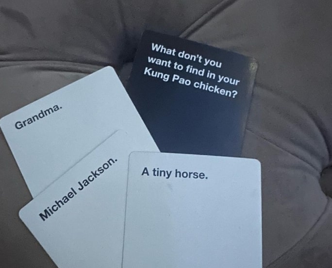 cards-against-humanity meme on the sofa