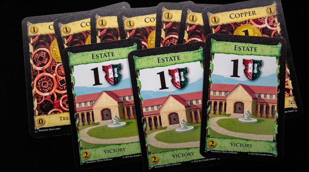three Estate cards from the Dominion board game