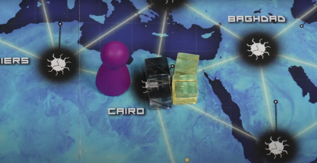player token and deciese-cubes in the Cairo on the Pandemic board game map